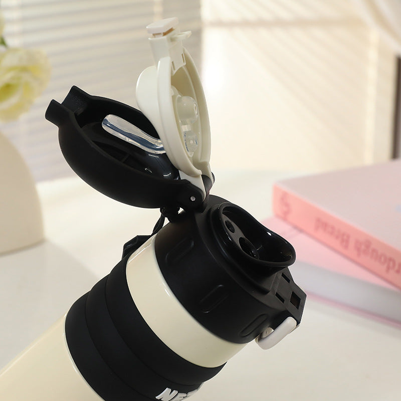 Insulated drinking bottle with a cute character design and practical carrying strap Kalsten