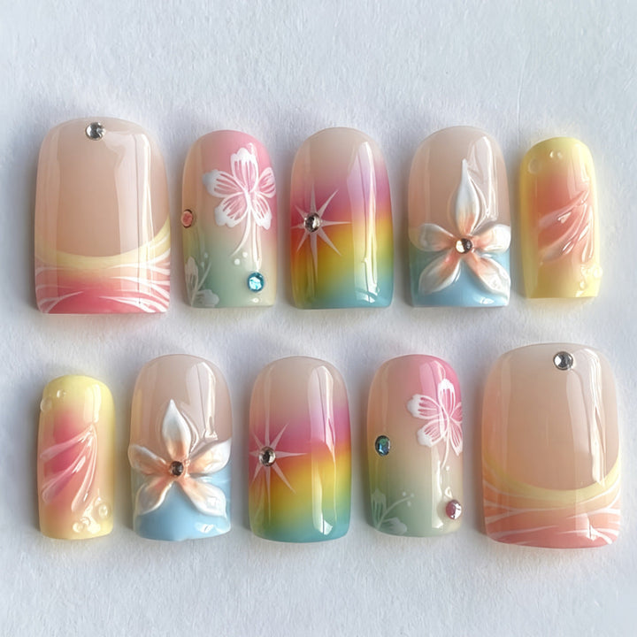 Acrylic nails with floral accents and gradient Kalsten