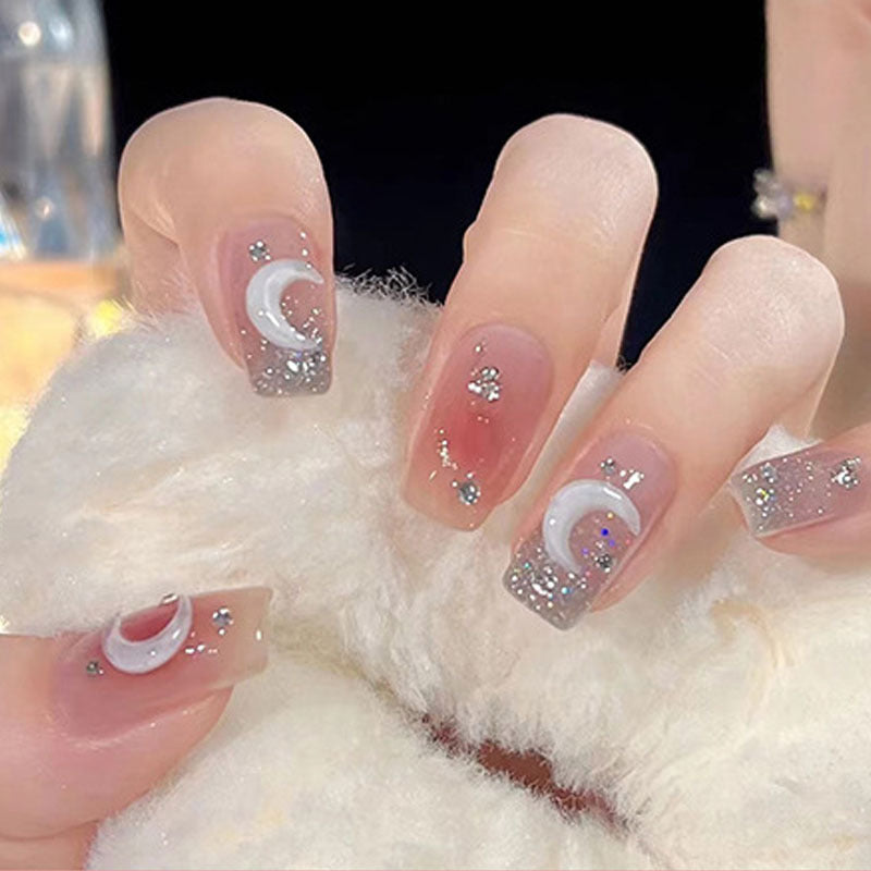 Glamorous artificial nails with delicate flower and glitter effects Kalsten