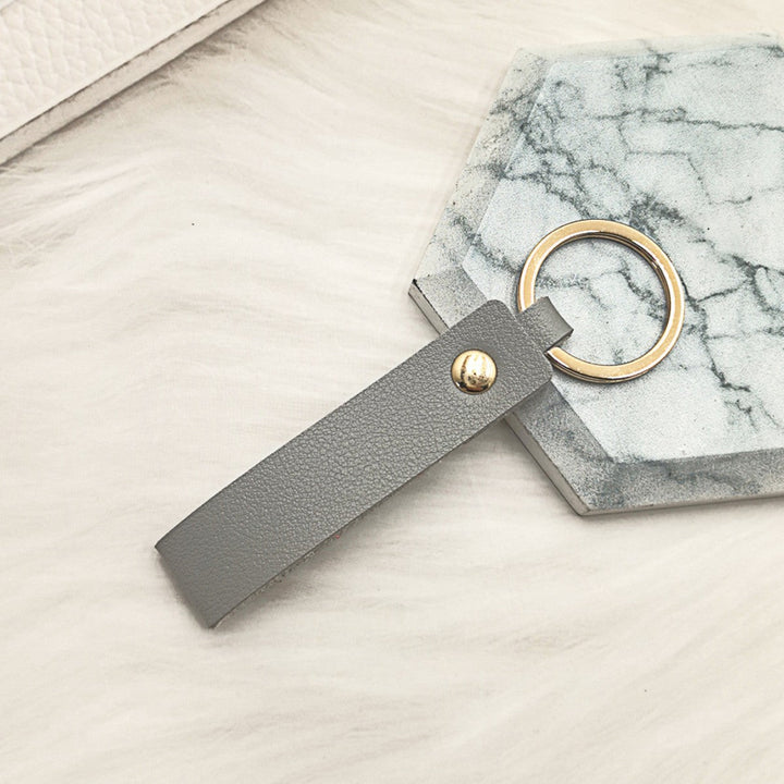 Unisex keychain made of high-quality synthetic leather with elegant metal embellishment Kalsten