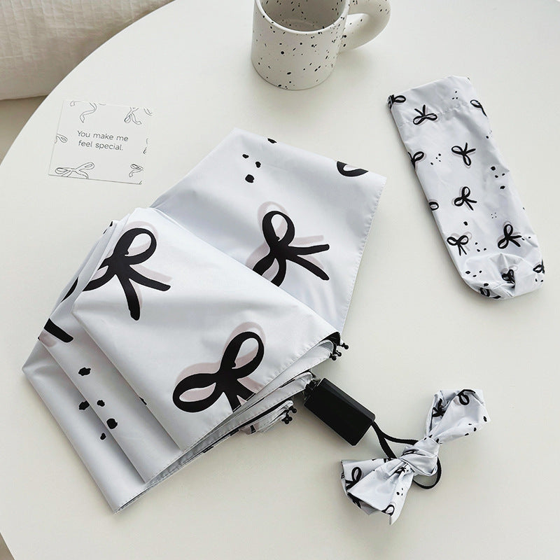 Women’s Folding Umbrella with Playful Bow Pattern Kalsten