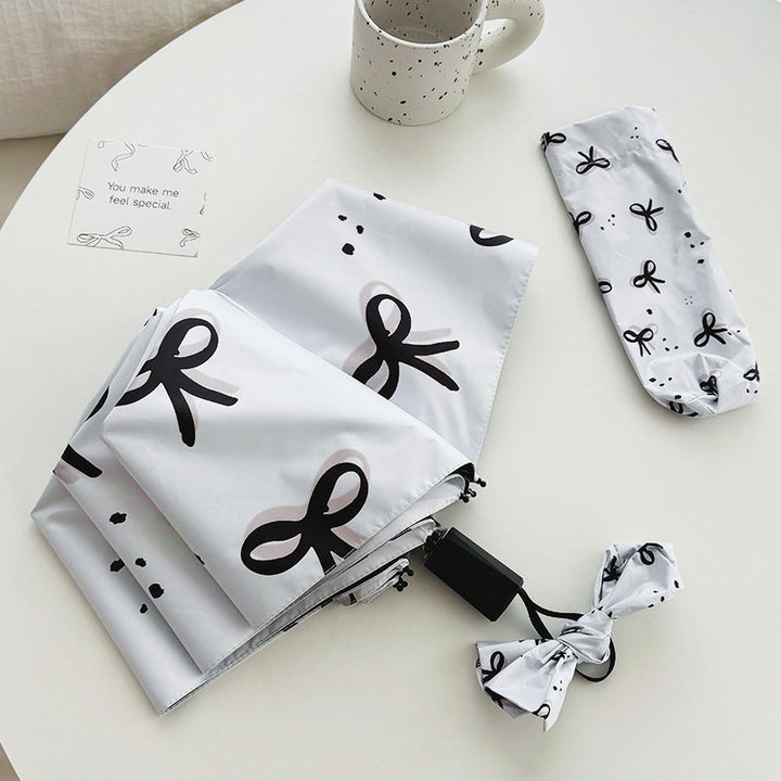 Women’s Folding Umbrella with Playful Bow Pattern Kalsten