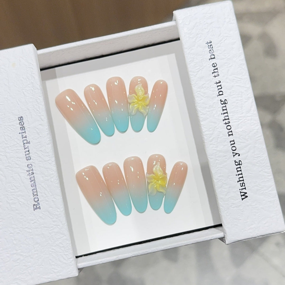 Artificial nails with enchanting ombre effect and floral accents Kalsten