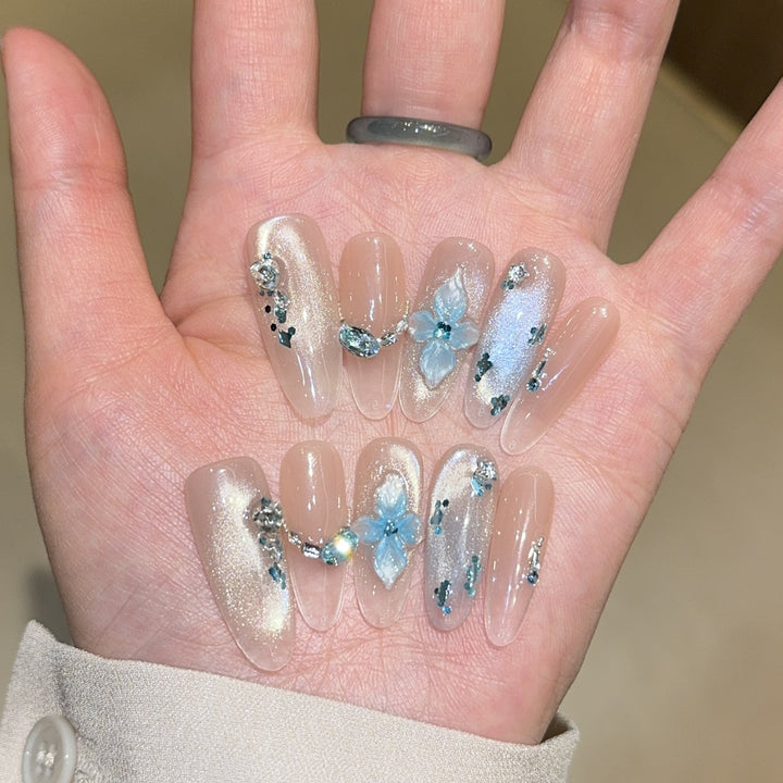 Artificial nails with unique floral design and glitter accents Kalsten