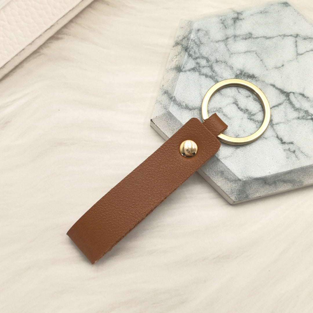 Unisex keychain made of high-quality synthetic leather with elegant metal embellishment Kalsten