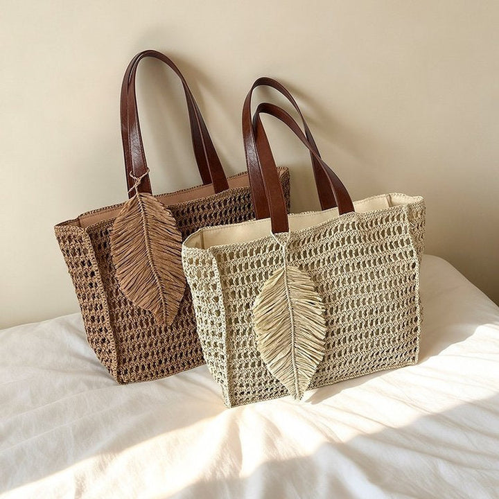 Handbag made of hand-woven natural material with decorative leaf shape design Kalsten