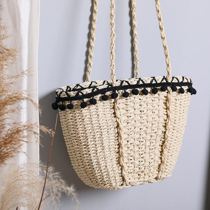Delicate beach bag with pompons Kalsten