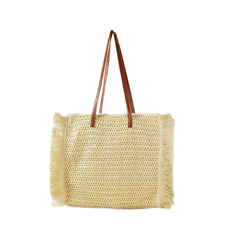 Beach bag made of raffia with fringed details Kalsten