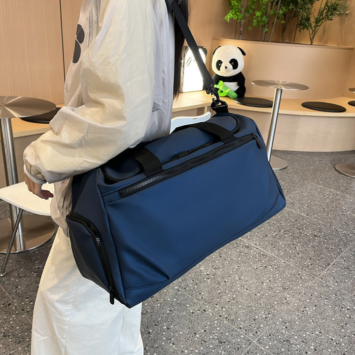 Sporty travel bag with reinforced carrying handles and multiple compartments Kalsten