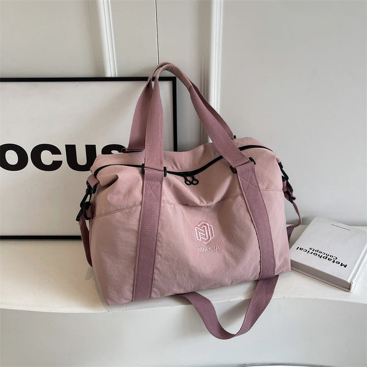 Sporty tote bag with multiple compartments and adjustable straps Kalsten