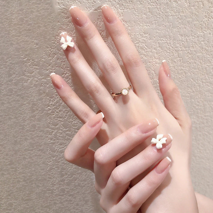 Artificial nails with heart accent and glamorous decorations Kalsten