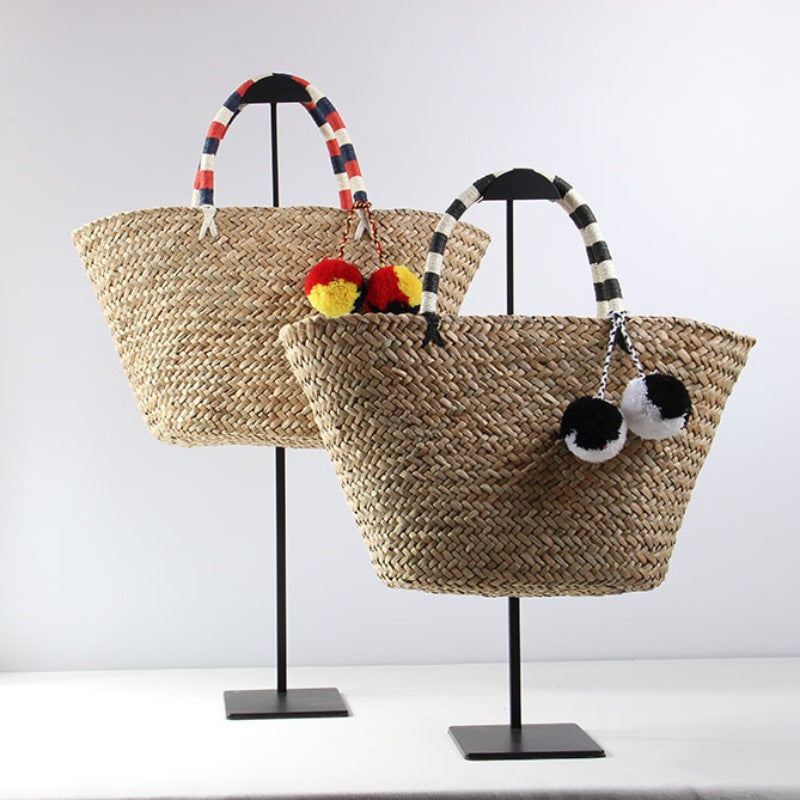 Braided beach bag with decorative pompons Kalsten