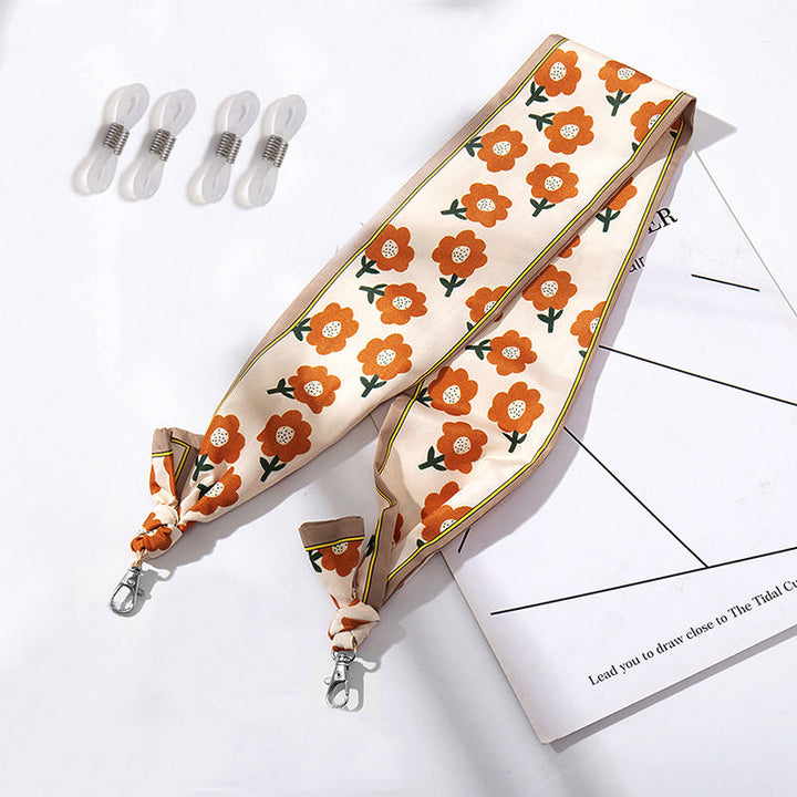 Fashionable fabric mask holder with floral motifs Kalsten