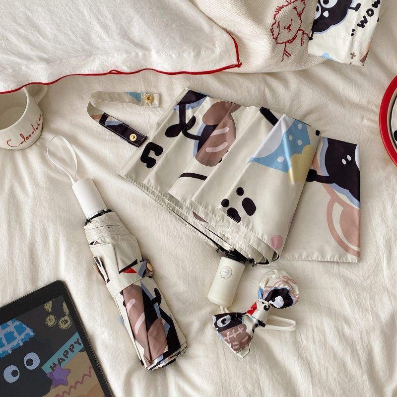 Ladies practical folding umbrella with playful design Kalsten