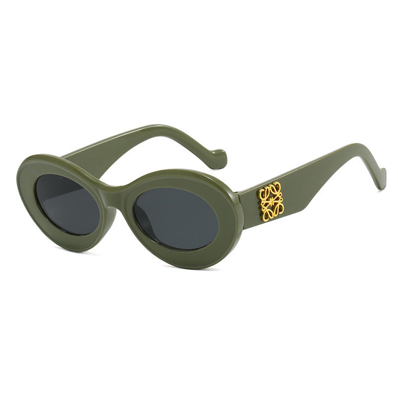 Women's fashionable sunglasses with oval frame and golden accents Kalsten