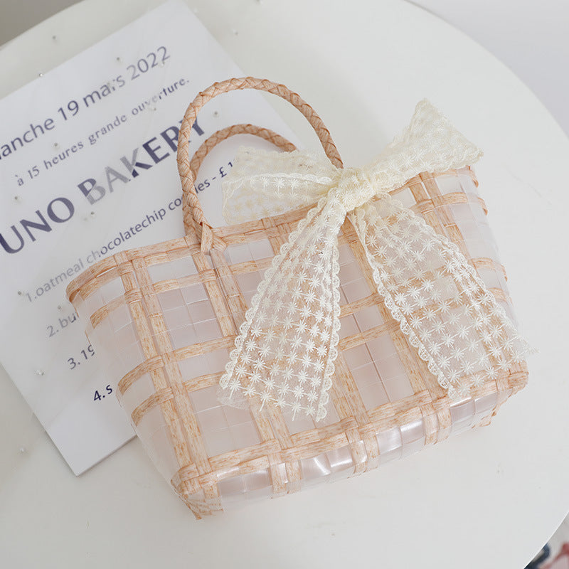 Handcrafted basket bag with elegant bow applique Kalsten