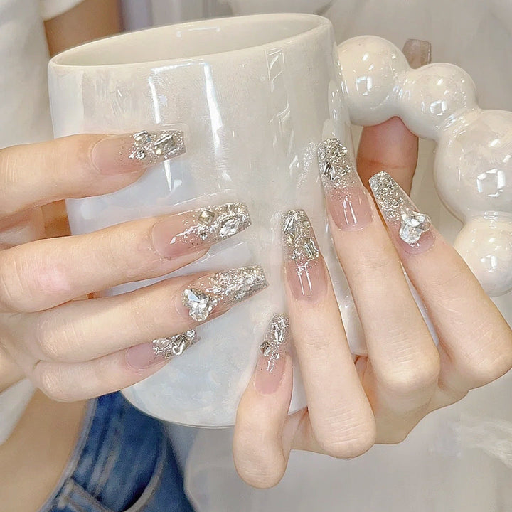 Artificial nails with heart design and glamorous accents Kalsten