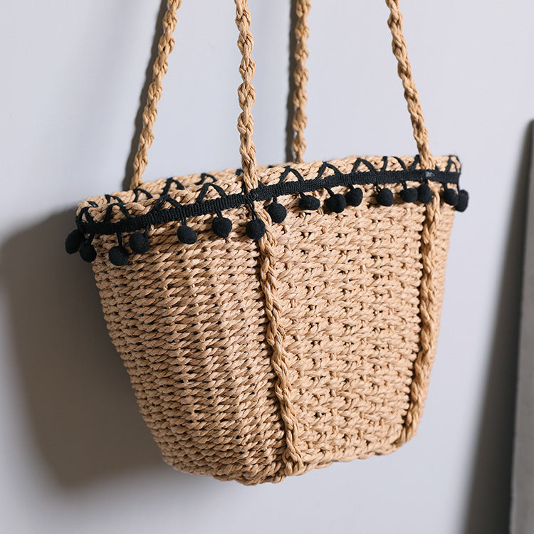 Delicate beach bag with pompons Kalsten
