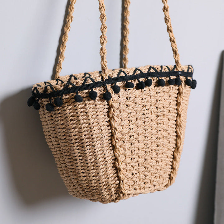 Delicate beach bag with pompons Kalsten