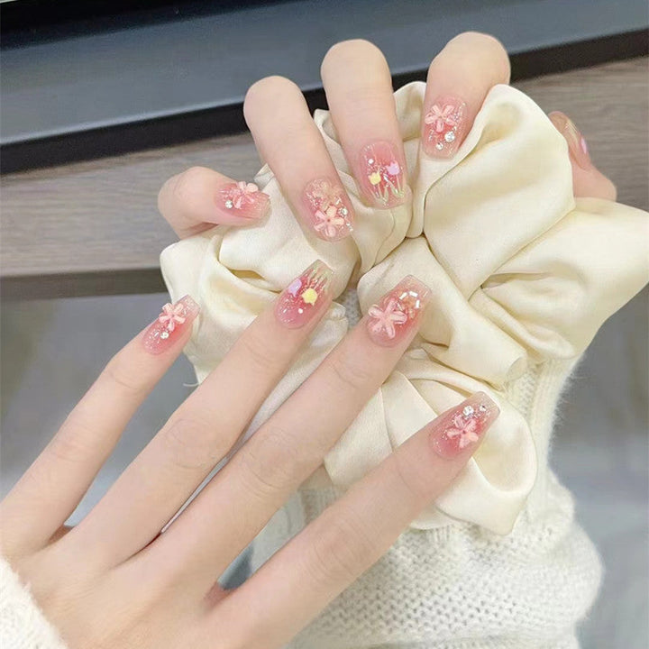 Artificial nails with floral design and glitter effects Kalsten