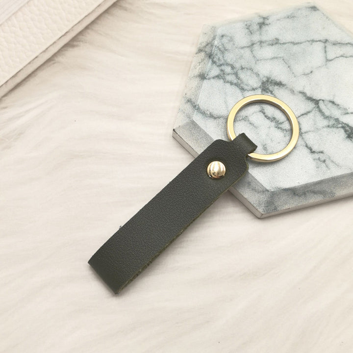 Unisex keychain made of high-quality synthetic leather with elegant metal embellishment Kalsten