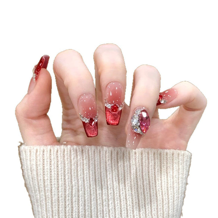 Glamorous artificial nails with sparkling rhinestone applications Kalsten