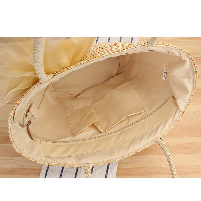 Elegant straw bag with floral accents Kalsten
