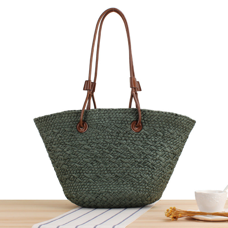 Beach bag made of high-quality braided straw with stylish leather handles Kalsten