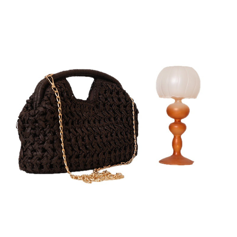 Handcrafted rattan bag with elegant handles and chain straps Kalsten