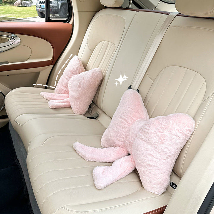 plush bow-shaped decorative throw cushion with long tails and faux-fur texture Kalsten