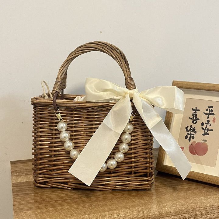 Ladies' basket bag with decorative pearl accents and bow decoration Kalsten