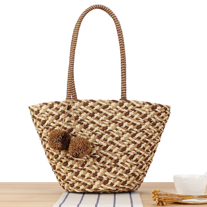 Summer wicker handbag with pom poms Kalsten
