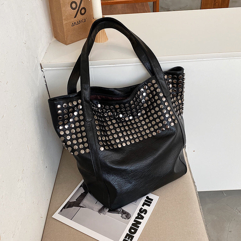 Fashionable shoulder bag with stylish rivet details Kalsten
