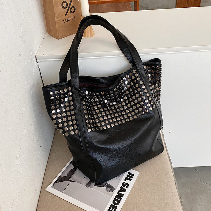 Fashionable shoulder bag with stylish rivet details Kalsten