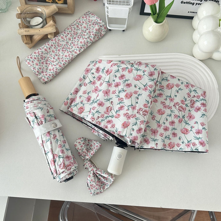 Women's folding umbrella with floral design and practical storage system Kalsten