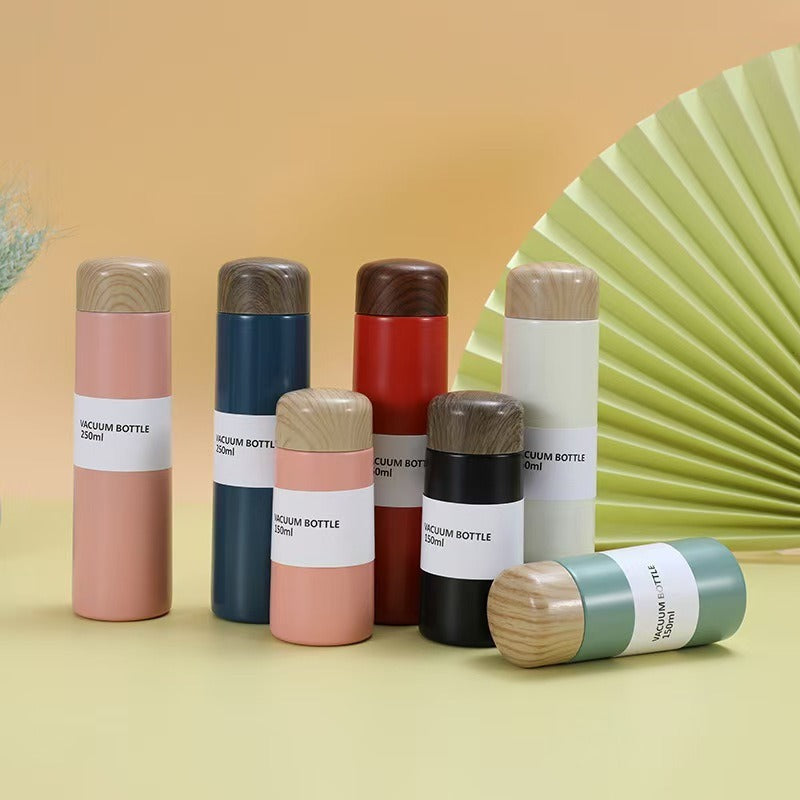 Women vacuum-insulated water bottle with innovative wooden lid Kalsten