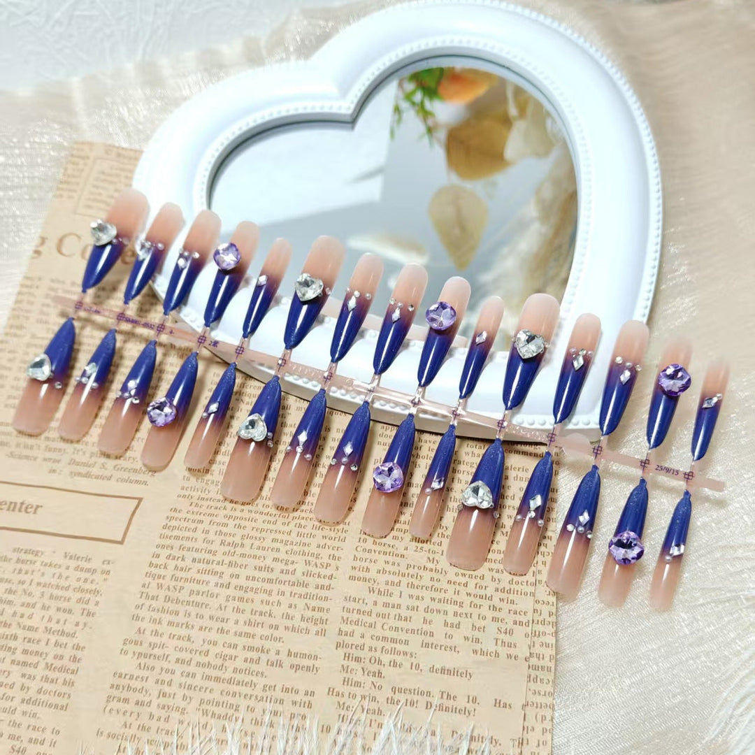Artificial nails with elegant glitter design and 3D rhinestone accents Kalsten