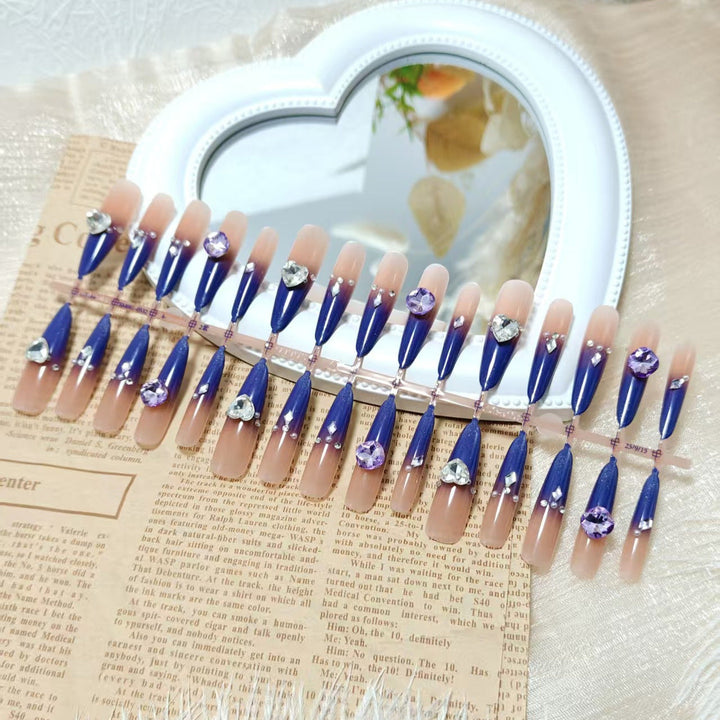 Artificial nails with elegant glitter design and 3D rhinestone accents Kalsten