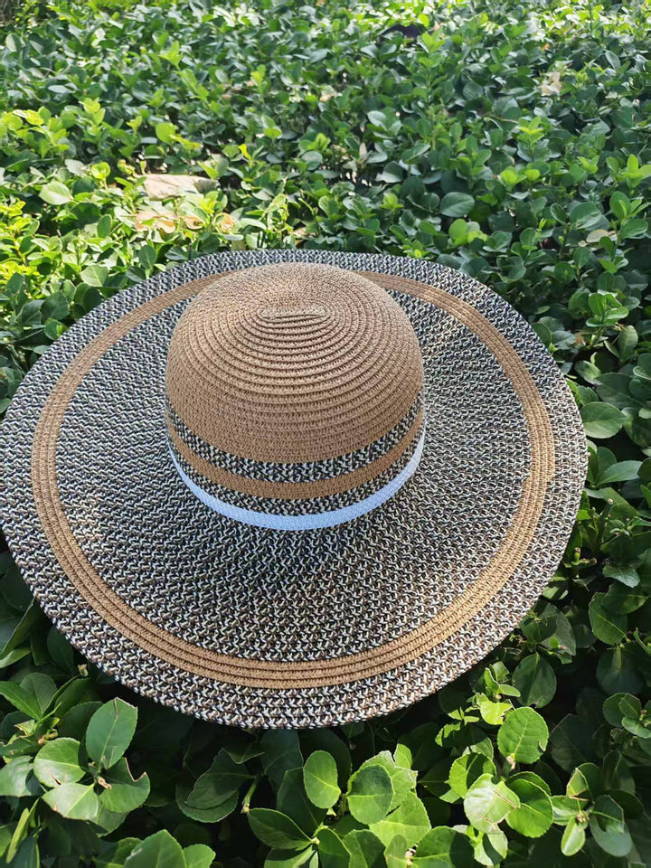 Elegant sun hat with wide brim and subtle stripe pattern Kalsten