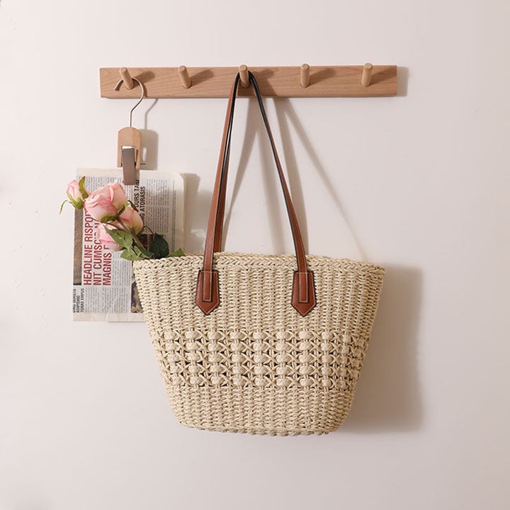 Handcrafted rattan basket bag with elegant leather accents Kalsten