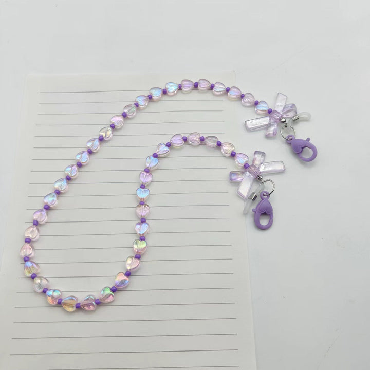 Fashionable glasses holder chain with heart and flower motifs Kalsten