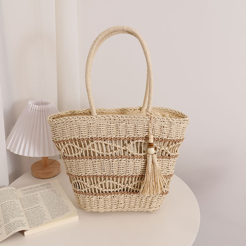 Handcrafted straw tote bag with decorative tassel detail Kalsten