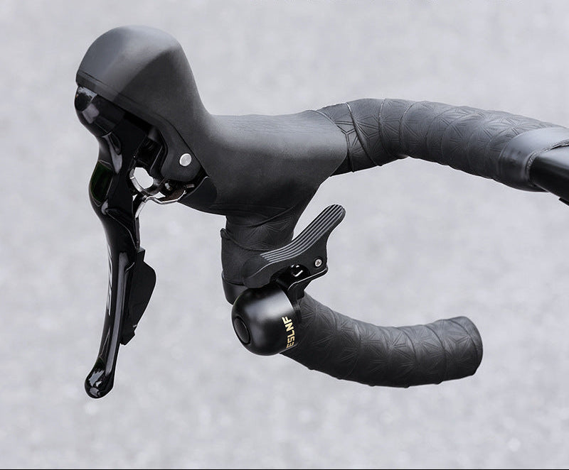 compact bicycle handlebar bell with quick release clamp and ergonomic thumb lever Kalsten