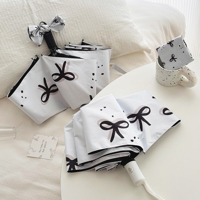 Women’s Folding Umbrella with Playful Bow Pattern Kalsten