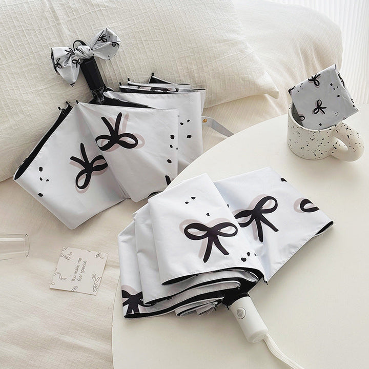Women’s Folding Umbrella with Playful Bow Pattern Kalsten