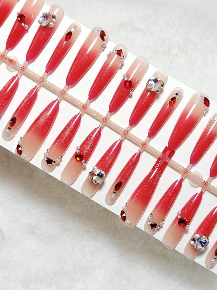 Glamorous artificial nails with sparkling ombre effect and elegant embellishments Kalsten