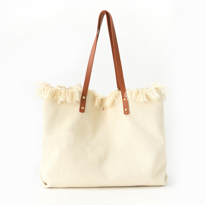 Beach bag with floral pattern and fringes Kalsten