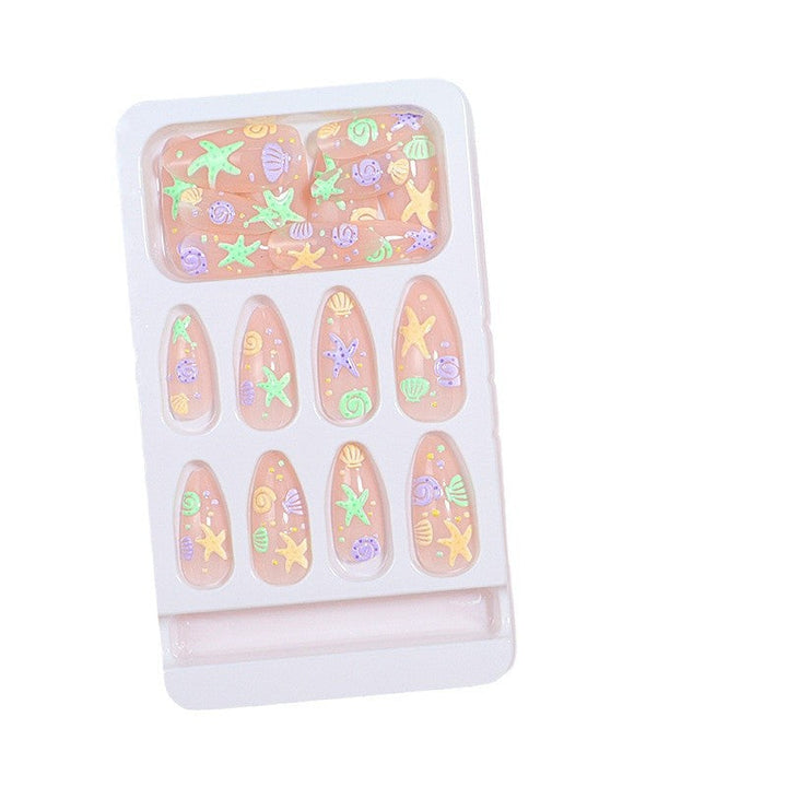 Artistic Press-On Nail Design with Ocean-Inspired Accents Kalsten