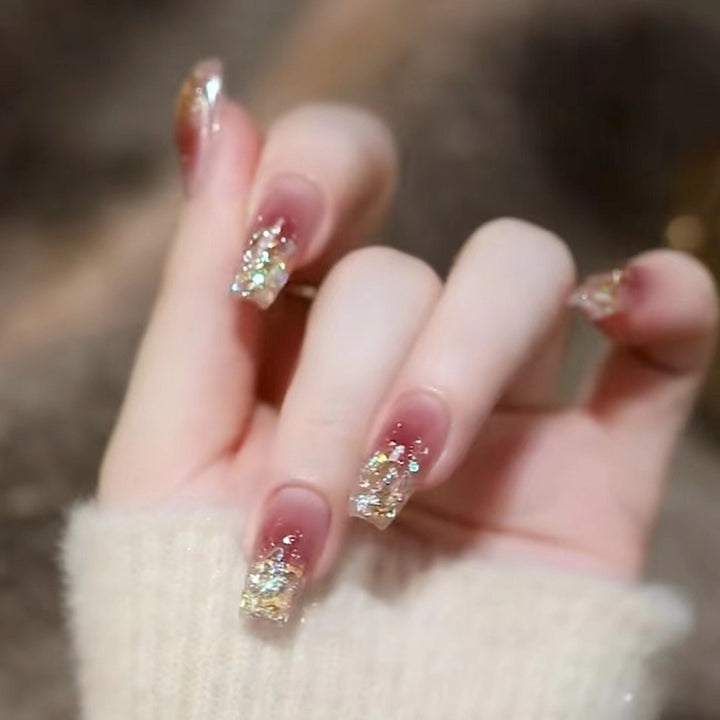 Glamorous artificial nails with delicate flower and glitter effects Kalsten