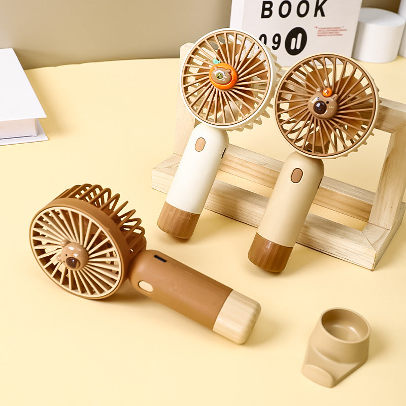 Cooling portable rechargeable handheld mini fan with detachable base stand cute animal-face safety grille USB-C charging Kalsten